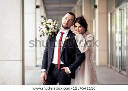 
the bride hugged the groom