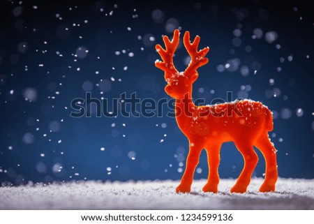 Christmas time background, red deer in snow, studio isolated