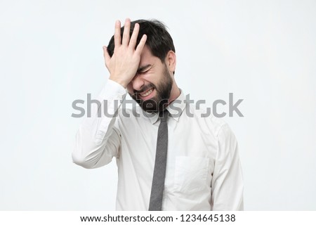 Hispanic man hold his head in hand forgotten something. Where I put my car keys concept. Royalty-Free Stock Photo #1234645138