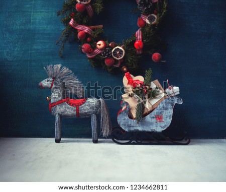 christmas ,new year,birthday card/ wooden toy horse with sledges ,gifts and christmas wreath /