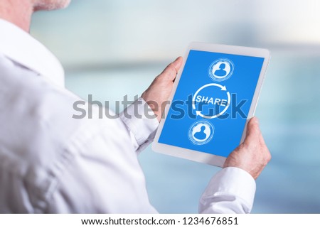 Tablet screen displaying a share concept
