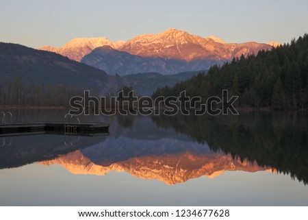 british columbia canada, one mile lake on the sea to sky highway at sunset, mountains in background with reflection in lake