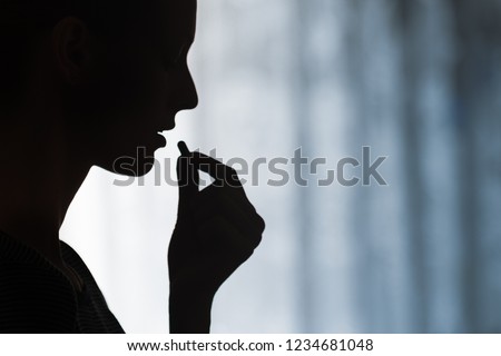 Close up of young woman taking prescription pill. Medicine, health care concept. Royalty-Free Stock Photo #1234681048