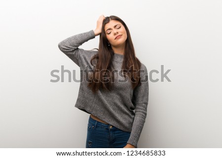 Teenager girl on isolated white backgorund with an expression of frustration and not understanding