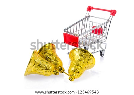 Shiny golden Christmas bells and shopping cart