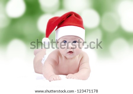 Baby in New Years hat on the bokeh background
