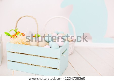 Easter decorations in pastel colors. Box with eggs. Light room with Easter decorations Royalty-Free Stock Photo #1234738360