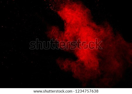 Abstract Red powder splatted background,Freeze motion of red powder exploding/throwing green dust.
