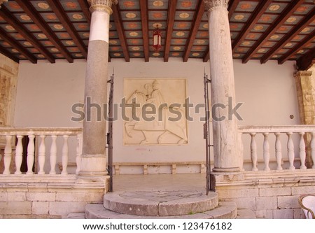 The historic city loggia built in the fifteenth century with the painted wooden ceiling in the Croatian city Trogir in Croatia