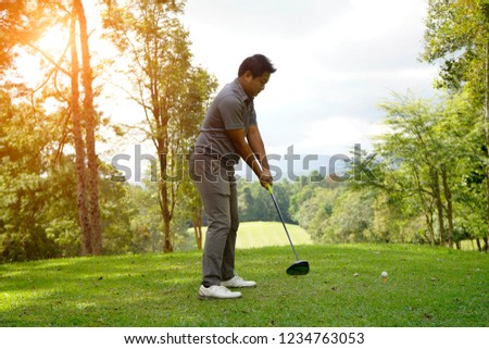 Golf concept. golfer playing golf in beautiful golf course in the evening golf course with sunshine in thailand