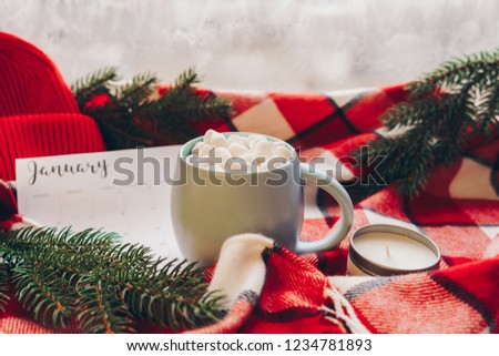 Calendar January month. Christmas concept. Coffee cup with marshmellow and holiday decoration.