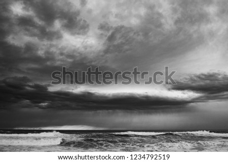 Storm in a cloudy beach