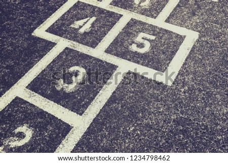 Children's Hopscotch Game on Concrete in a School Playground