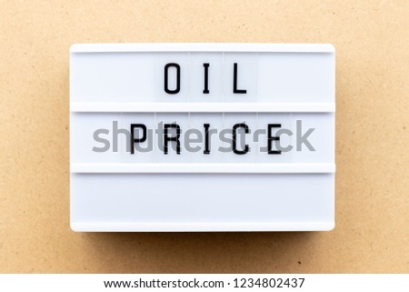 Light box with word oil price on wood background