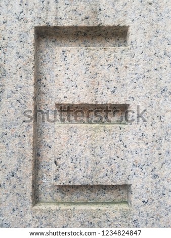 Historic carved stone capital letters