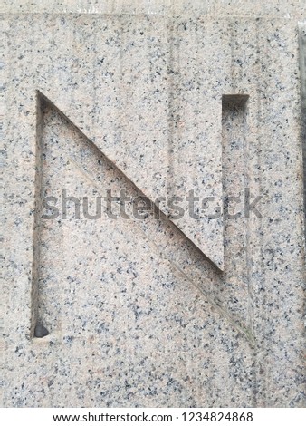 Historic carved stone capital letters