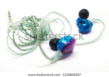 Earphone blue earbuds isolated on white background. photo