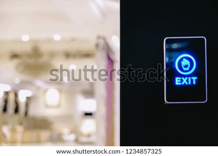 Push button on wall to exit
