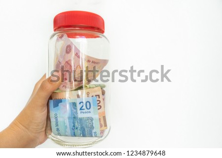 Mexican money savings in jar