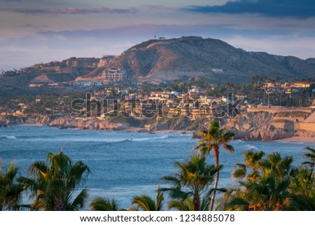 Looking over palm trees across the Sea of Cortez at Los Cabos, San Jose Mexico,  Royalty-Free Stock Photo #1234885078