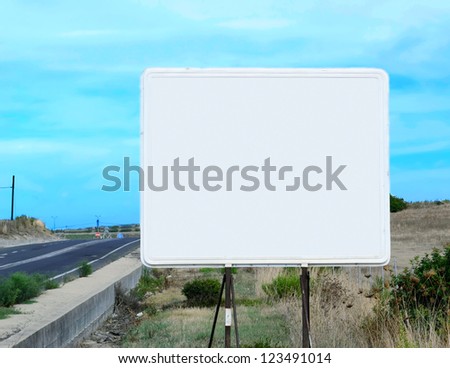 blank billboard on a out-of-town street