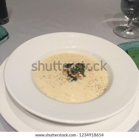 creamy clam chowder soup on white bowl.