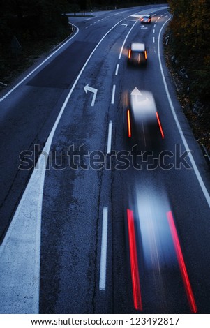 Highway with cars motion blur at dusk