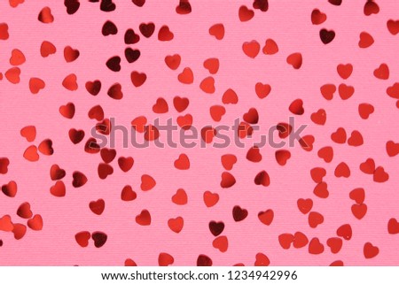 Pink background with red confetti hearts  for Valentine Day