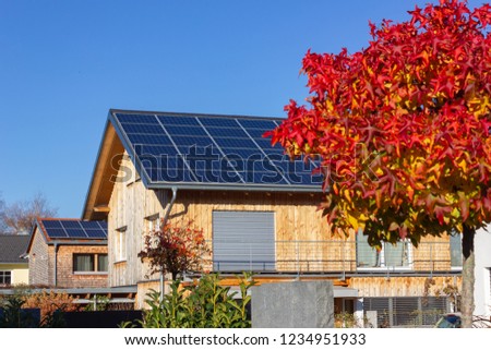 rooftop of buildings with solar panels in germany bavaria colorful autumn sunhine afternoon Royalty-Free Stock Photo #1234951933