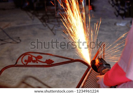 Metal Grinding and colorful sparks