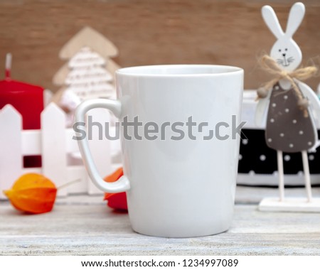 Mug mocap - a template for a Christmas or New Year design, a white cup on a wooden background