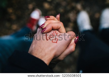 Happy couple holding hands together as forever love. Valentine day.