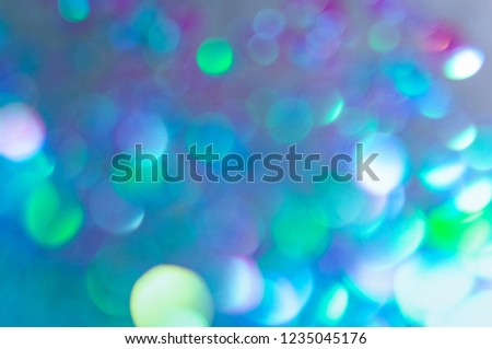 Winter abstract background. Blue, white and purple blurred circles.
