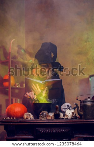 Photo of witch on cauldron with steam