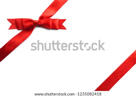 Red satin gift bow isolated on white background