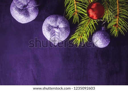 New Year and Christmas decorations on a toned wooden background.