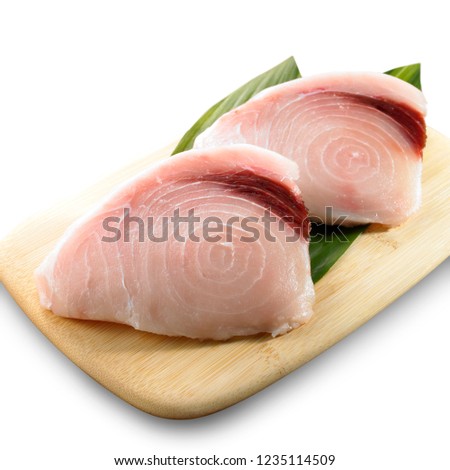 Swordfish fillets on cutting board Royalty-Free Stock Photo #1235114509