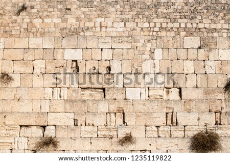 The Western Wall, Wailing Wall, or Kotel,[known in Islam as the Buraq Wall,is an ancient limestone wall in the Old City of Jerusalem Royalty-Free Stock Photo #1235119822