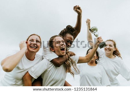 Female football players celebrating their victory Royalty-Free Stock Photo #1235131864