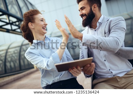 Picture of man and beautiful woman as business partners