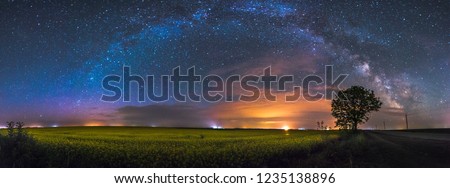 Spring field under the stars Royalty-Free Stock Photo #1235138896