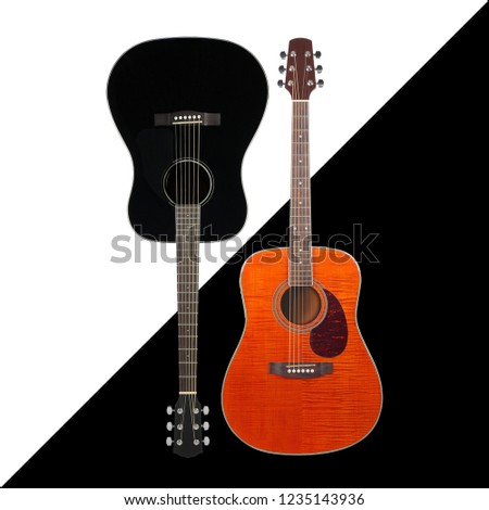 Musical instrument - Black and tiger flame maple western acoustic guitar on a black and white background.