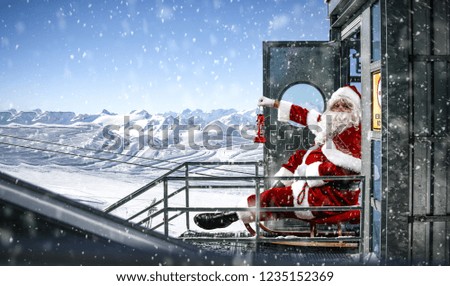 Red old Santa Claus and winter landscape of mountains. Free space for your decoration and snowflakes 