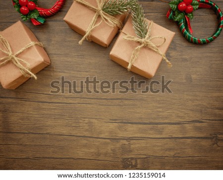 Flat lay,top view Christmas ornaments and Christmas gifts on wooden background with copy space