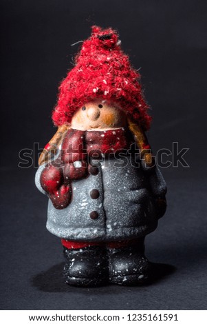 Little girl winter decoration isolated black background