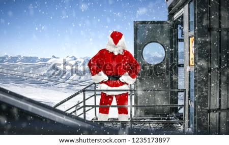 Red old Santa Claus in home and landscape of mountains. Free space for your decoration. 