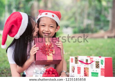 Asian mother and daughter smiling with happy in merry christmas day or Xmas celebrate