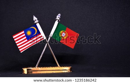 Malaysia and Portugal table flag with black Background