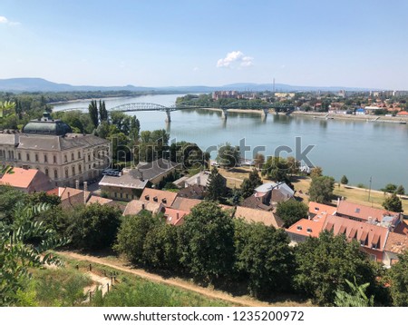 This photo I took is the view of Duna river from the Castle Esztergom. Bridge shown in the photo is Maria Valeria Bridge. On the photo you can see two countries in one picture. Slovakia and hungary.