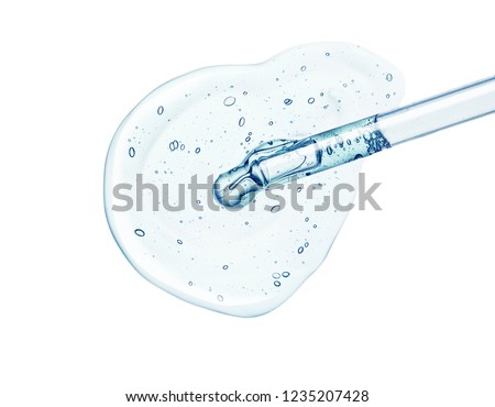 Liquid gel or serum on a screen of microscope white isolated background Royalty-Free Stock Photo #1235207428